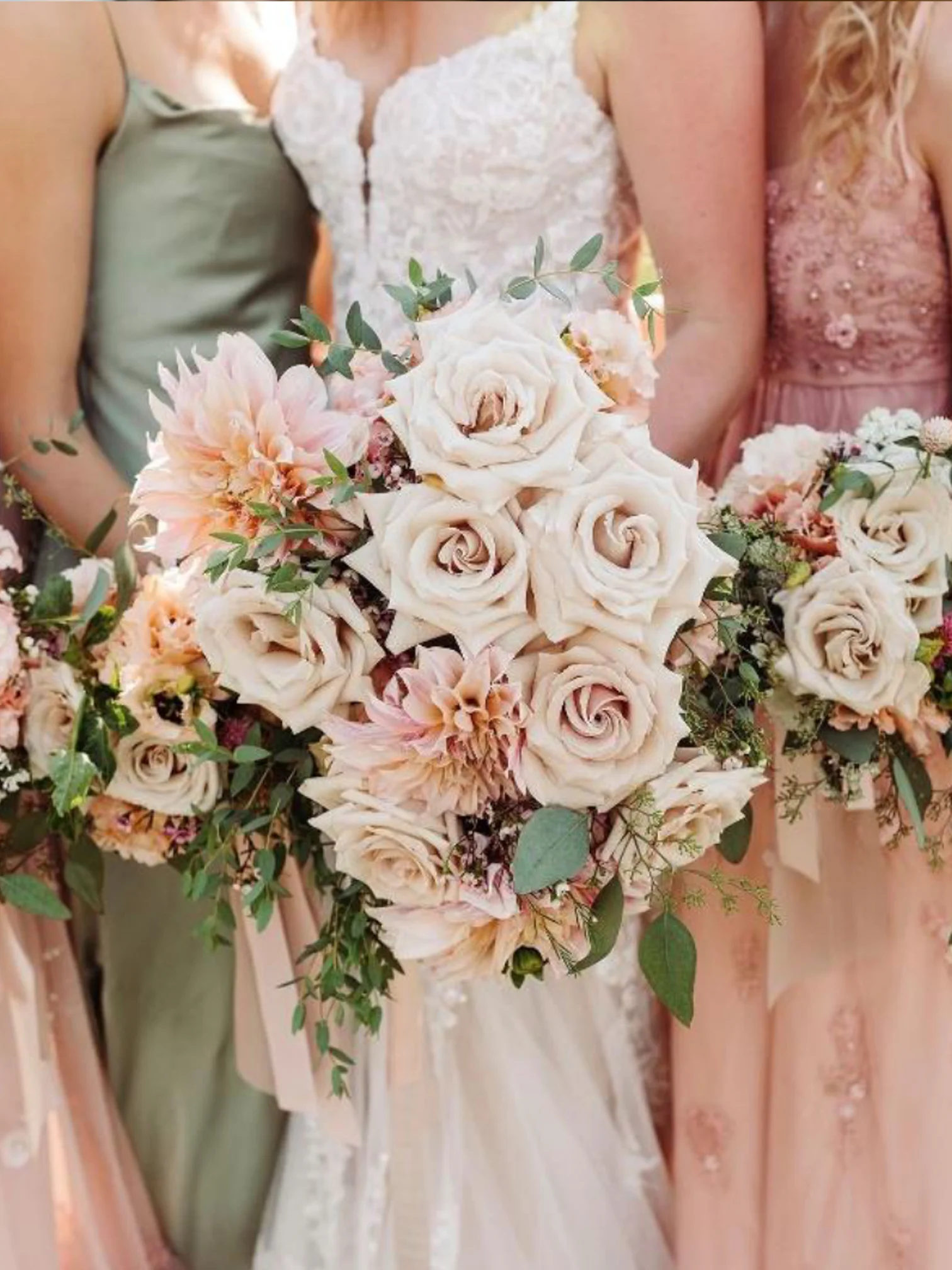 women holding bouquets at wedding